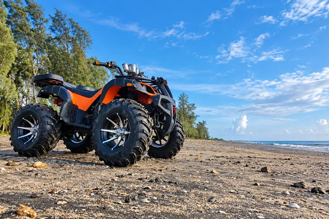Orange quad bike parked on a beach