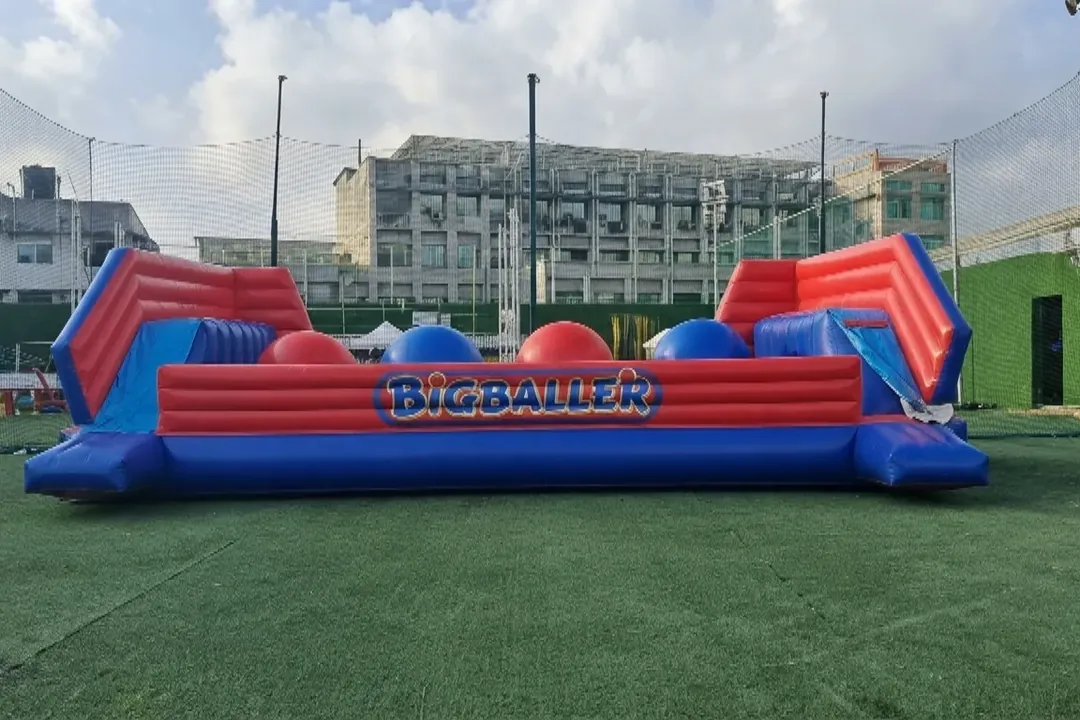 Inflatable Big Baller course with giant balls on a lawn