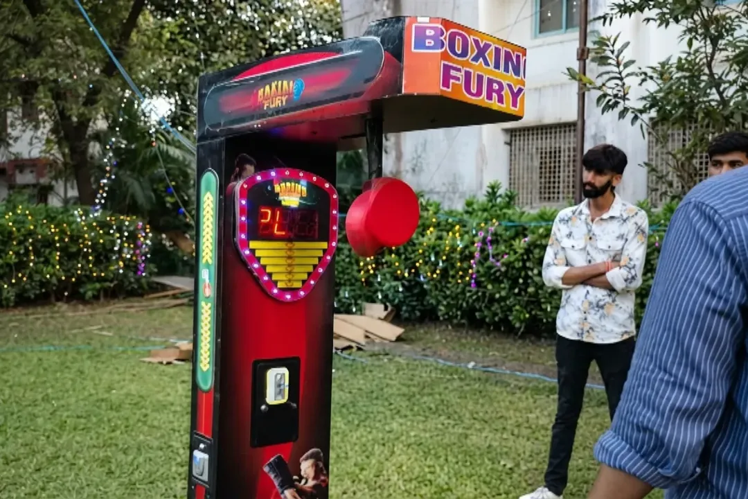 Boxing arcade machine set up outdoors at an event