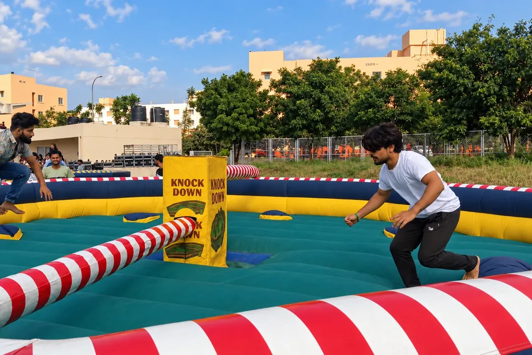 Players dodging the arm of an inflatable eliminator game