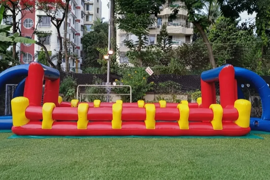 Inflatable human foosball pitch set up on artificial turf