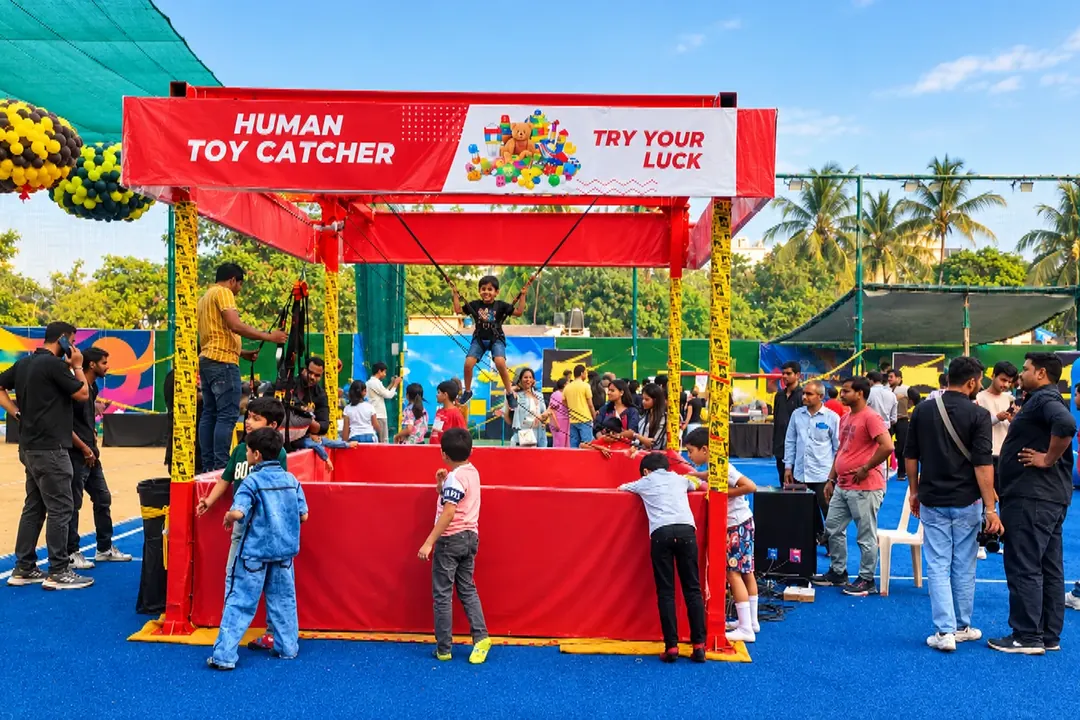 Human toy catcher booth at an outdoor event