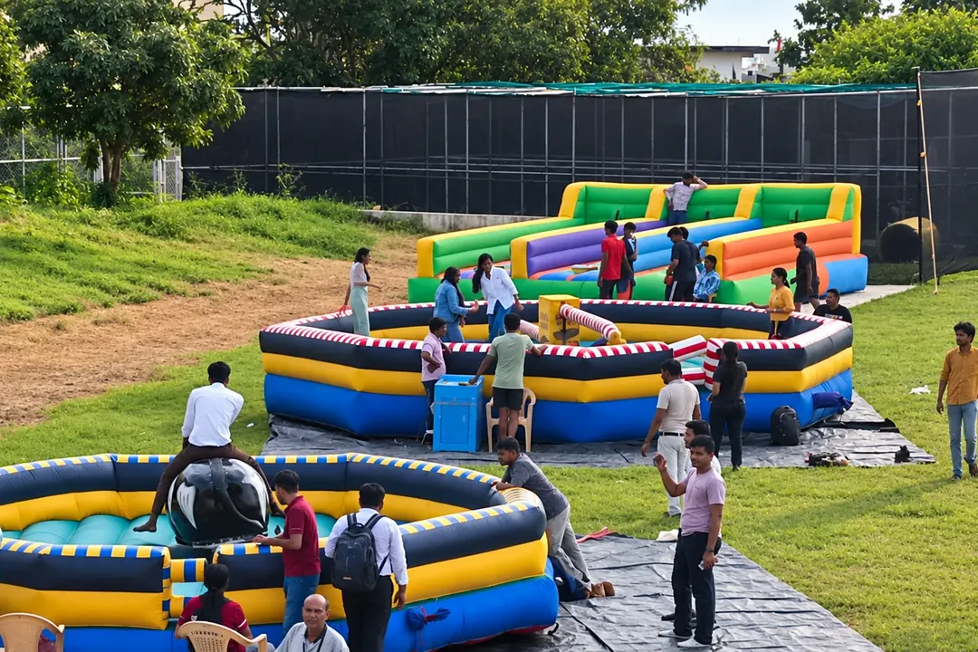 Inflatable games zone on a lawn with colourful inflatable arenas
