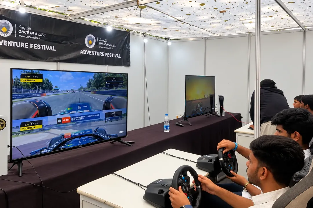 Guests playing a racing simulator at an event booth