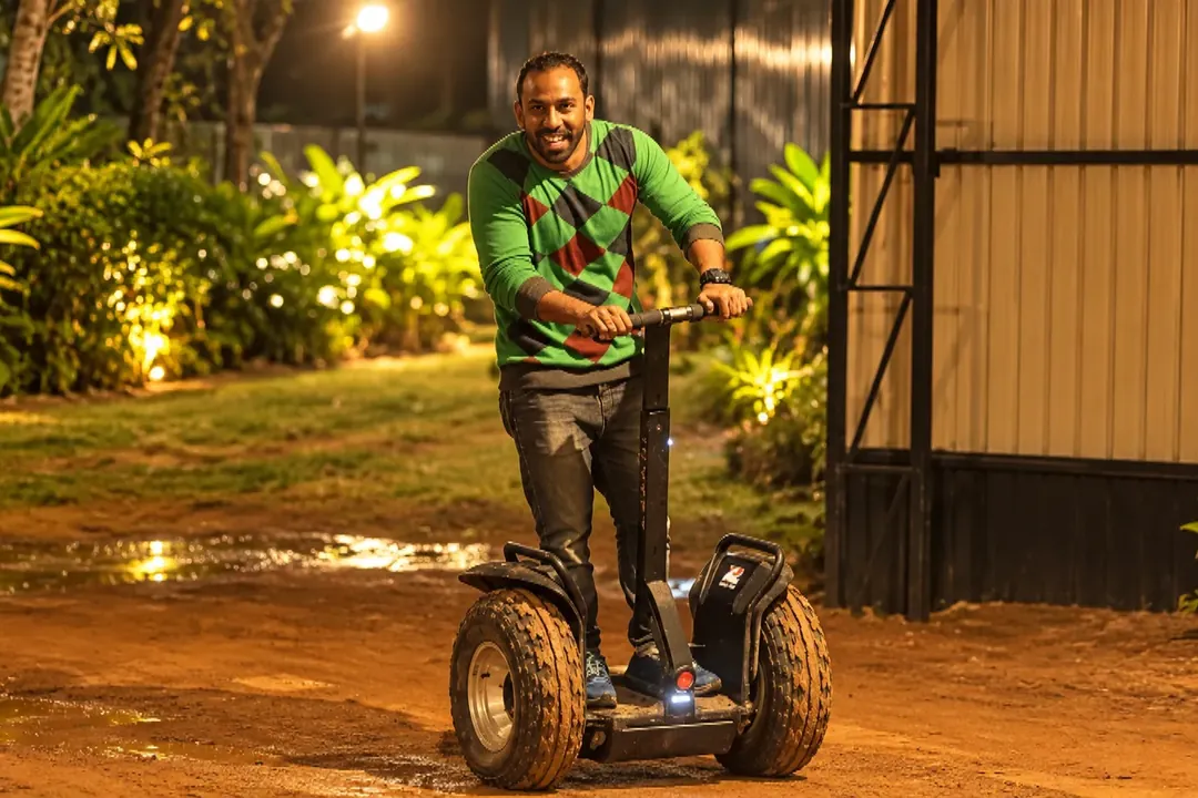 Man riding a Segway at an outdoor event